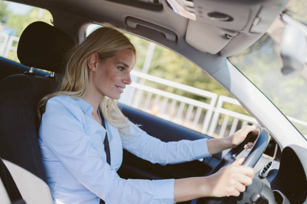 istock Businesswoman driving car 858103796