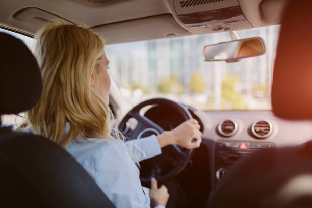 istock Businesswoman driving car 858104012