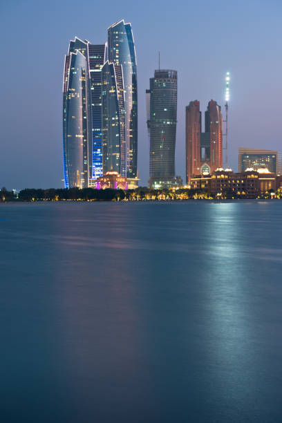 istock Abu Dhabi buildings skyline from the sea at night 858106442
