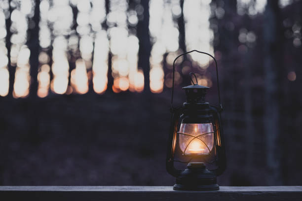 istock Vintage style lamp with a candle at night 858107598