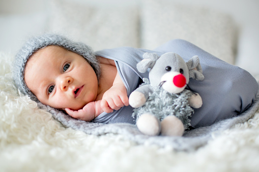 Little Newborn Baby Boy Looking Curiously At Camera Stock Photo - Download  Image Now - iStock