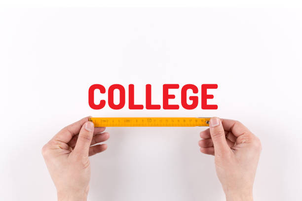 istock BUSINESSMAN MEASURING COLLEGE 858118110