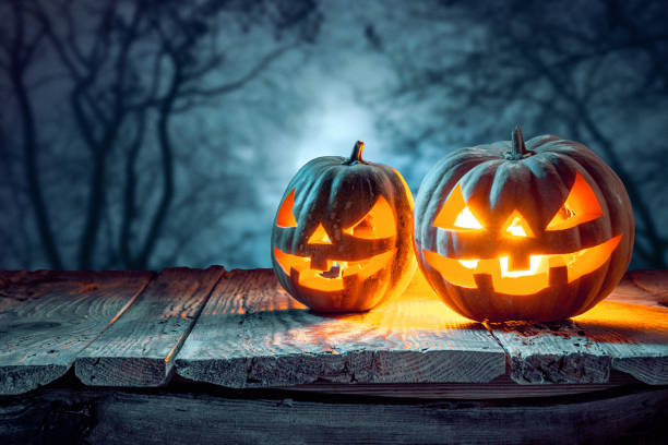 istock Halloween pumpkins on blue background 858118430