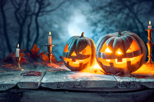 istock Halloween pumpkins on blue background 858118762