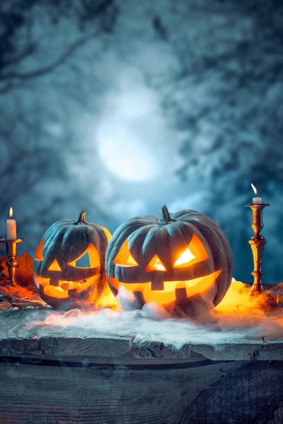 istock Halloween pumpkins on blue background 858118816