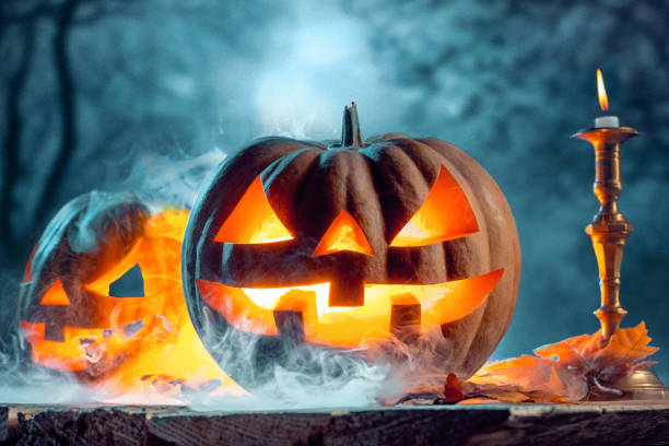 istock Halloween pumpkins on blue background 858119152