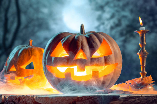 istock Halloween pumpkins on blue background 858119230