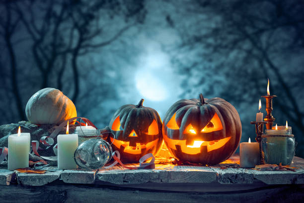 istock Halloween pumpkins on blue background 858119458