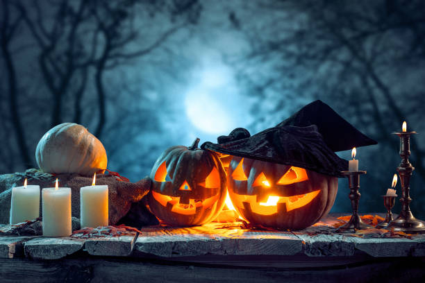 istock Halloween pumpkins on blue background 858119710