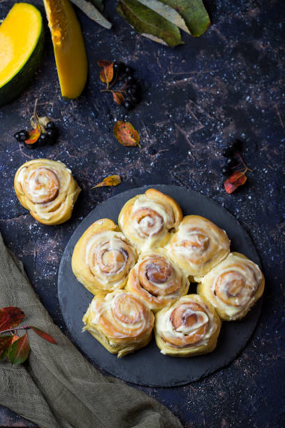 istock fresh pumpkin cinnabon buns with cinnamon and frosting 858122554