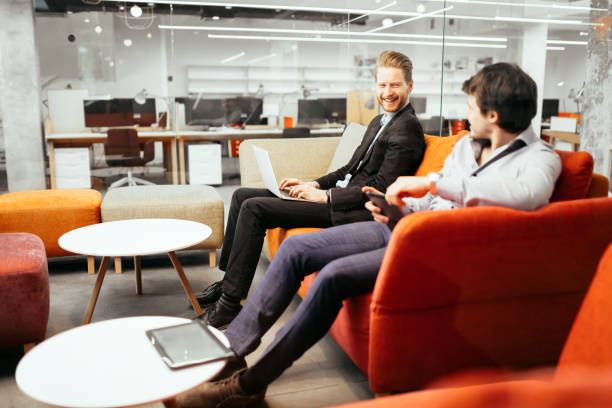istock Succesful businesspeople working on devices 858123014