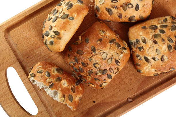 istock Pumpkin seed bread roll on cutting board. Isolated with clipping path. Directly Above. 858125988