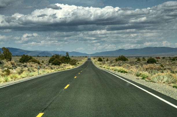 istock A very long long straight road throug american desert 858126510