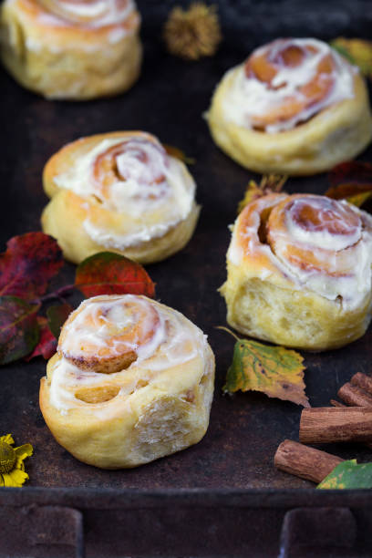 istock fresh pumpkin cinnabon buns with cinnamon and frosting 858128126