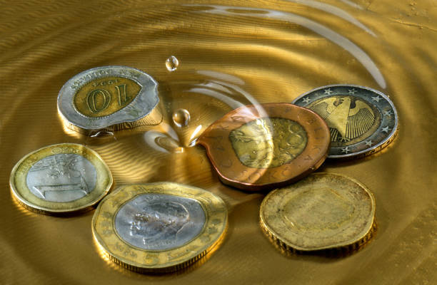 coins on a golden tray filled with water