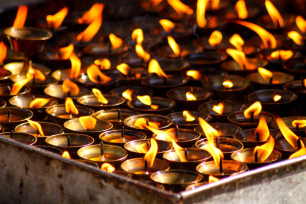istock Lighted candle offerings at Swayambunath Temple 858140040