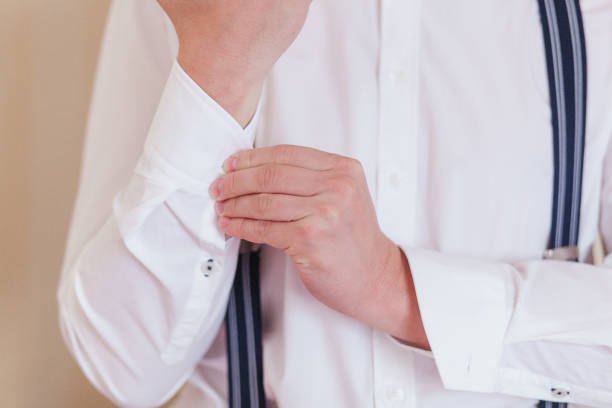 istock A man in a blue suit straightens his sleeves 858143610