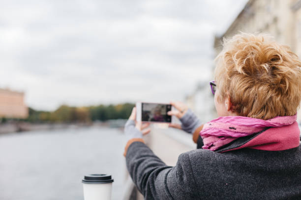istock Woman taking shots from waterfront 858144158