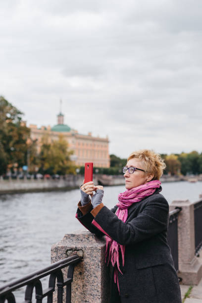 istock Woman taking shots on waterfront 858144198