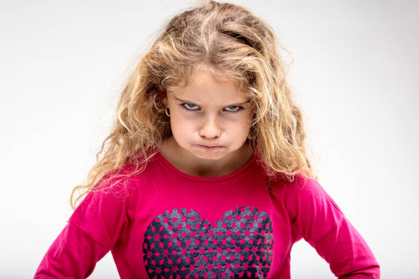 preteen sulky girl making angry face - beautiful female displeased furious imagens e fotografias de stock