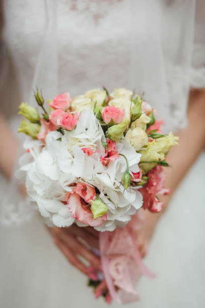 istock Bride holding big wedding bouquet on wedding ceremony 858145322