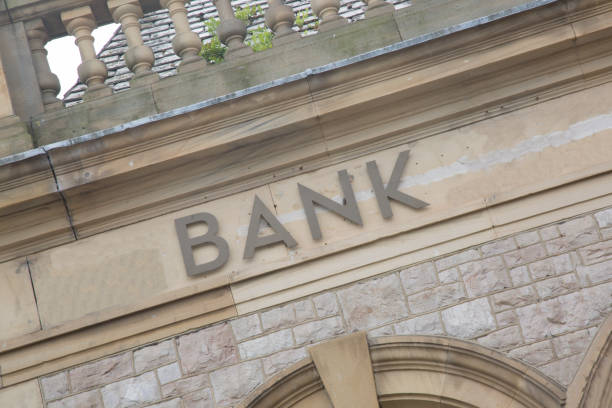 istock Bank Sign on Stone Wall Facade; England 858149026