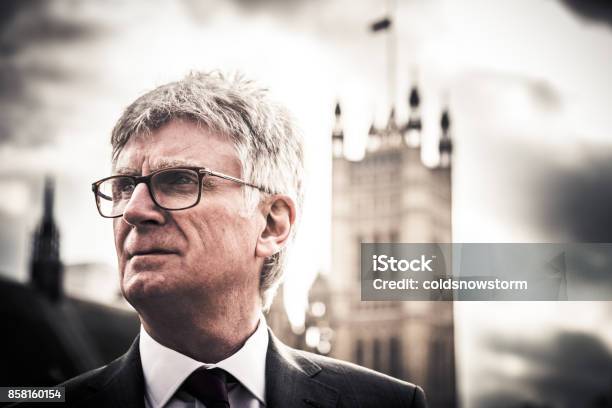 Close Up Of Senior Caucasian Businessman Outside Houses Of Parliament London Uk Stock Photo - Download Image Now