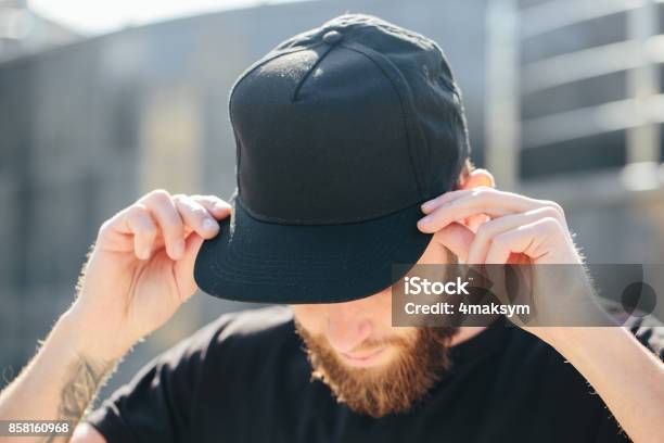 Hipster Handsome Male Model With Beard Wearing Black Blank Baseball Cap With Space For Your Logo Stock Photo - Download Image Now