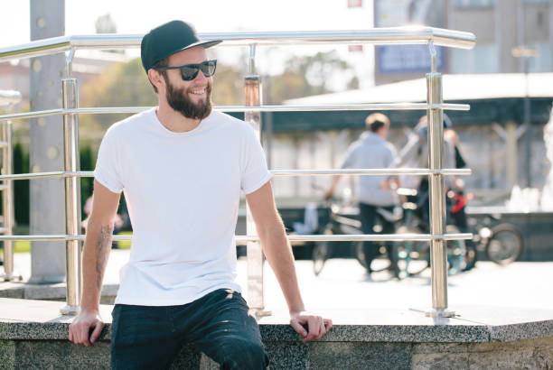 istock Hipster handsome male model with beard wearing white blank t-shirt 858164786