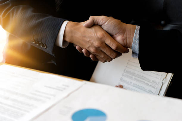 istock Businessman hand together Handshake for business project 858165406