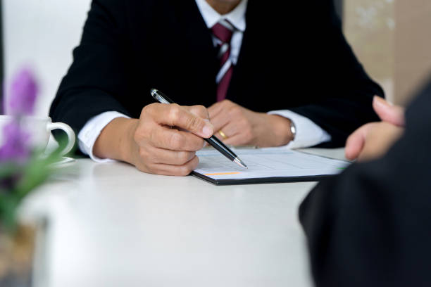 istock boss sitting to a new work who just pass 858165494