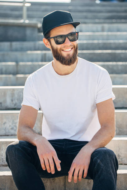 istock Hipster handsome male model with beard wearing white blank t-shirt 858165950