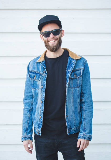 istock Handsome hipster man smiling wearing trendy jeans clothes 858166394