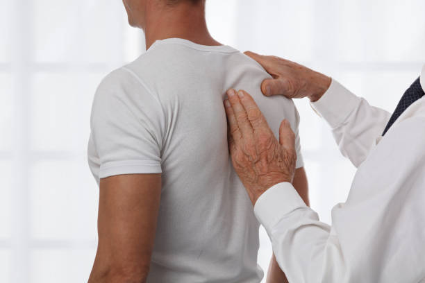 istock Chiropractic back adjustment. Osteopathy, Alternative medicine, pain relief concept. Physiotherapy, sport injury rehabilitation 858169406