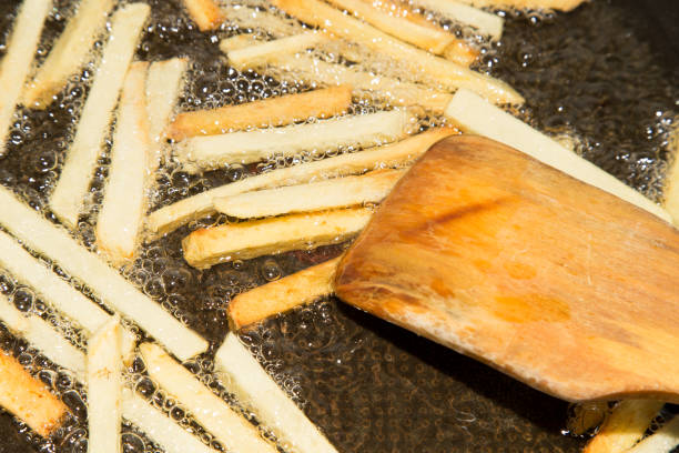 istock French fries are fried in a pan 858177558
