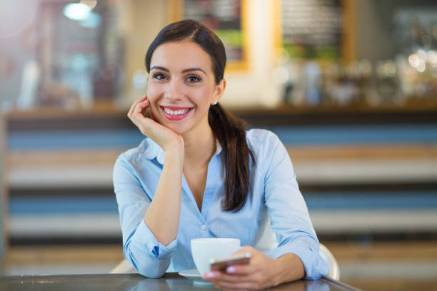 istock Woman with coffee and smart phone 858177748