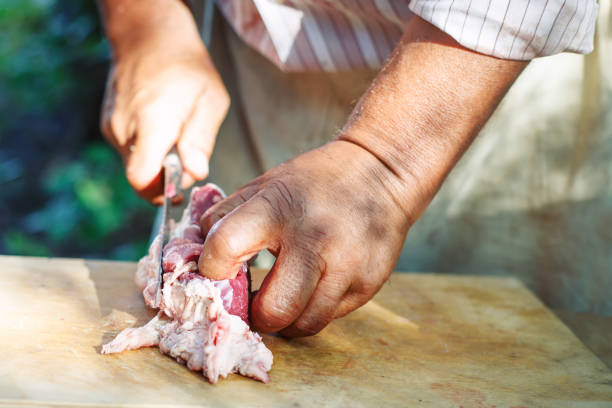 istock The man cuts meat of a ram for pilaf 858178104