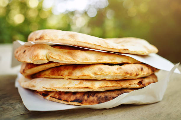 istock A stack of pita bread on a wooden table 858178260