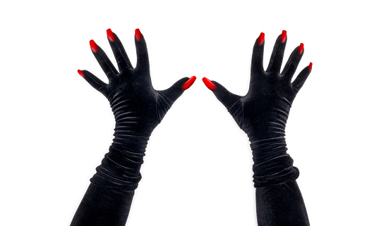 Two black velvet female evening glove hands with coffin shaped  red fingernails