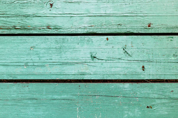 istock The old green wood texture with natural patterns 858182106