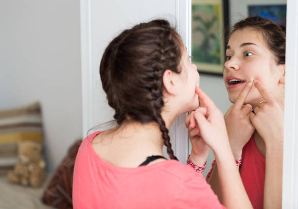 istock Girl cleaning pores 858197886