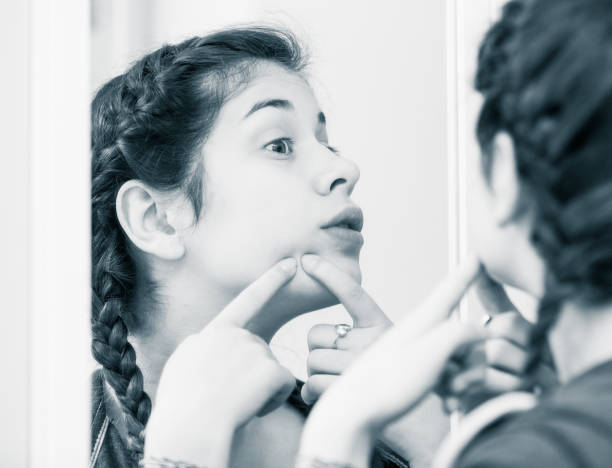istock Girl cleaning pores 858197916