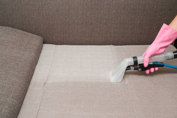 istock Sofa chemical cleaning with professionally extraction method. Hand in rubber protective glove holding nozzle of extractor. Upholstered furniture. Early spring or regular clean up. 858208136