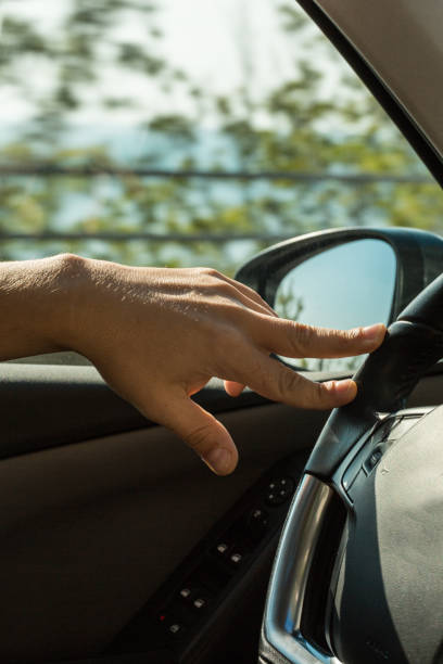 istock Close-Up Of Man Driving Car 858212220