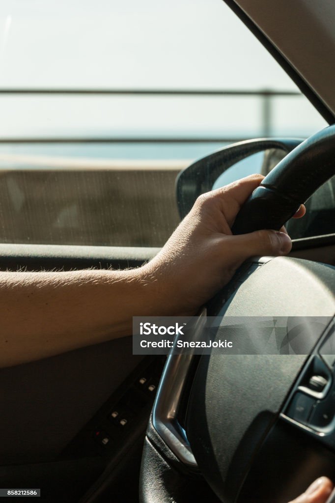 Hand on the wheel 30-39 Years Stock Photo