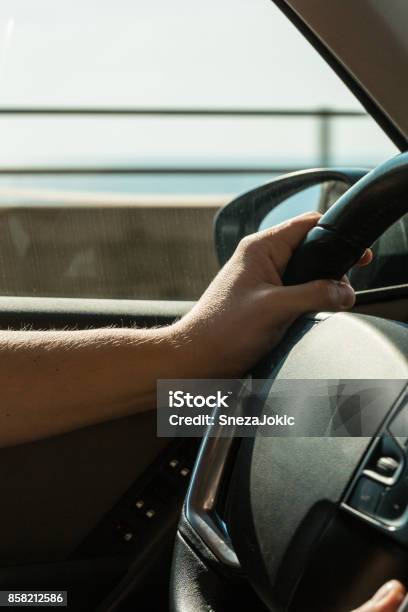 Hand On The Wheel Stock Photo - Download Image Now - 30-39 Years, Adult, Adults Only