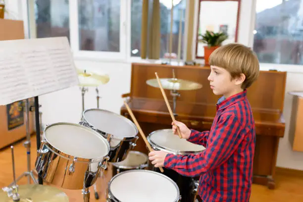 Photo of Kid Studying Drums