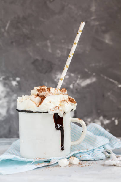 istock cocoa with cream and cinnamon on a concrete background 858216368