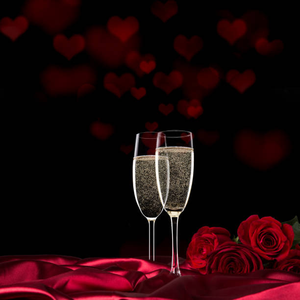Sparkling valentine day with champagne and roses, close-up.