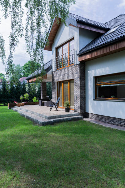 istock House with brick walls and garden 858216604
